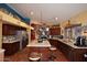 Spacious kitchen with stainless steel appliances, granite countertops, and an island with seating, perfect for cooking at 14605 S 35 Pl, Phoenix, AZ 85044