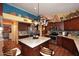 Bright kitchen features custom cabinets, stainless appliances, kitchen island and decorative tile backsplash at 14605 S 35 Pl, Phoenix, AZ 85044