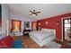 Primary bedroom showcasing natural light, and terra cotta flooring at 14605 S 35 Pl, Phoenix, AZ 85044