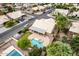 Aerial view of backyard pool, patio, and tropical landscaping in a well-maintained neighborhood at 1523 E Tulsa St, Chandler, AZ 85225