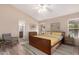 Bright bedroom featuring a ceiling fan, en-suite bathroom, and a spacious layout at 1523 E Tulsa St, Chandler, AZ 85225