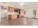 Open bedroom with custom built-ins, desk, vaulted ceiling, tile flooring and outdoor access at 1523 E Tulsa St, Chandler, AZ 85225