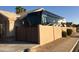 Home exterior displaying RV behind privacy wall, gated entrance, and desert landscaping at 1523 E Tulsa St, Chandler, AZ 85225