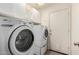 Functional laundry room with modern washer and dryer units and ample cabinet space at 1523 E Tulsa St, Chandler, AZ 85225