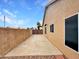Spacious side yard with gravel landscaping, block fencing, and double gate for privacy and functionality at 1523 E Tulsa St, Chandler, AZ 85225