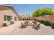 Backyard featuring a fire pit area and gravel landscaping at 15642 N Naegel Dr, Surprise, AZ 85374