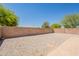 Backyard featuring gravel and block wall for privacy at 15642 N Naegel Dr, Surprise, AZ 85374
