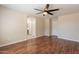 Bright, open bedroom with wood floors, and ensuite bathroom at 15642 N Naegel Dr, Surprise, AZ 85374