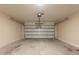 Spacious two-car garage with an automatic door and concrete floor at 15642 N Naegel Dr, Surprise, AZ 85374