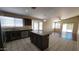 Spacious kitchen with granite countertops, an island, and ample cabinet space at 15642 N Naegel Dr, Surprise, AZ 85374