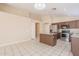 Spacious kitchen featuring an island, stainless steel appliances, granite countertops, and tile floors at 15642 N Naegel Dr, Surprise, AZ 85374
