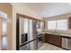 Stainless steel appliances, granite countertops, and modern fixtures highlight this kitchen at 15642 N Naegel Dr, Surprise, AZ 85374