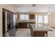 Bright kitchen with stainless steel appliances, granite counters, and center island at 15642 N Naegel Dr, Surprise, AZ 85374