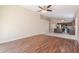 Open layout with wood floors leading into kitchen featuring an island, stainless steel appliances and dining area at 15642 N Naegel Dr, Surprise, AZ 85374