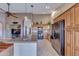 Well-lit kitchen with a functional layout, granite countertops, ample cabinet space, and modern appliances at 16230 E Glenpoint Dr, Fountain Hills, AZ 85268