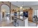 Bright kitchen features a center island, pendant lighting, and ample cabinetry at 16230 E Glenpoint Dr, Fountain Hills, AZ 85268