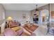Comfortable living room featuring neutral walls, ceiling fan, and an open archway to other rooms at 16230 E Glenpoint Dr, Fountain Hills, AZ 85268