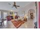 Spacious living area with vaulted ceilings, cozy seating, and an open layout connecting to the kitchen at 16230 E Glenpoint Dr, Fountain Hills, AZ 85268