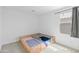 Bedroom featuring twin beds and window, offering bright and fresh space at 16956 W Alice Ave, Waddell, AZ 85355
