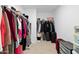Walk-in closet with ample hanging space and shelving for storage at 16956 W Alice Ave, Waddell, AZ 85355