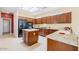 Modern kitchen featuring granite countertops, stainless appliances, and custom cabinets at 17192 W Hermosa Dr, Surprise, AZ 85387