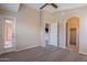 Bright bedroom with neutral tones, carpet flooring, and a door leading to a balcony at 18250 N 32Nd St # 1019, Phoenix, AZ 85032