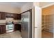 Functional kitchen featuring stainless steel appliances, dark wood cabinets, and ample storage at 18250 N 32Nd St # 1019, Phoenix, AZ 85032
