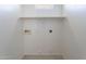 Practical laundry room with washer hookups and a shelf at 18250 N 32Nd St # 1019, Phoenix, AZ 85032