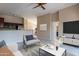 Open living space with modern decor, tile floors, and view of kitchen and breakfast nook at 18250 N 32Nd St # 1019, Phoenix, AZ 85032