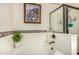 Bright bathroom showcasing a soaking tub with decorative tile and a separate glass-enclosed shower at 18563 W Fairway Dr, Surprise, AZ 85374