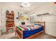Cozy bedroom featuring wood furniture, colorful decor and a spacious layout at 18563 W Fairway Dr, Surprise, AZ 85374