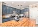 Modern kitchen with sleek, stylish countertops, stainless steel appliances, and a practical island at 18563 W Fairway Dr, Surprise, AZ 85374