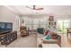 Comfortable living room with modern furniture, plush carpeting, and large windows for ample light at 18563 W Fairway Dr, Surprise, AZ 85374