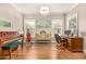 Elegant office space with natural light, complemented by stylish furnishings and classic piano at 18563 W Fairway Dr, Surprise, AZ 85374