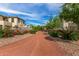 Charming community path with flowering bushes along the gravel trail, perfect for leisurely walks and enjoying nature at 18563 W Fairway Dr, Surprise, AZ 85374