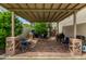 Outdoor patio with brick flooring, seating and a grill, perfect for entertaining or relaxing at 18563 W Fairway Dr, Surprise, AZ 85374