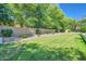 Green backyard featuring a lush lawn and a brick wall providing privacy at 1890 E Sagittarius Pl, Chandler, AZ 85249