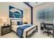 Bedroom features a queen size bed, bedside tables, and a work desk at 1890 E Sagittarius Pl, Chandler, AZ 85249