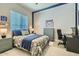 A baseball themed bedroom features a comfortable bed and matching furniture at 1890 E Sagittarius Pl, Chandler, AZ 85249