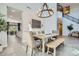Stylish dining room features a modern chandelier and a spacious layout near the stairs at 1890 E Sagittarius Pl, Chandler, AZ 85249