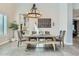 Well-lit dining room showcases a rustic wooden table and comfortable seating for a welcoming space at 1890 E Sagittarius Pl, Chandler, AZ 85249
