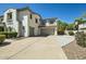 Large driveway leading to a three-car garage and a basketball hoop at 1890 E Sagittarius Pl, Chandler, AZ 85249
