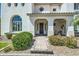 Charming front entrance with stone pathway, desert landscaping, and elegant columns at 1890 E Sagittarius Pl, Chandler, AZ 85249