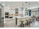 Open-concept kitchen featuring white cabinetry, a large center island, and stainless steel appliances at 1890 E Sagittarius Pl, Chandler, AZ 85249