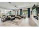 Spacious living room features modern decor, tile floors, and an open floor plan to the kitchen and dining area at 1890 E Sagittarius Pl, Chandler, AZ 85249