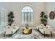 Elegant living room featuring plantation shutters, neutral furniture, and high ceilings at 1890 E Sagittarius Pl, Chandler, AZ 85249