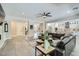 Bright living room boasts an open layout, tile flooring, and seamless transition to kitchen and dining spaces at 1890 E Sagittarius Pl, Chandler, AZ 85249
