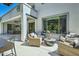Inviting outdoor living space with wicker seating, a fire pit, and seamless indoor-outdoor flow at 1890 E Sagittarius Pl, Chandler, AZ 85249