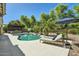 Backyard pool area featuring lounge chairs, a built-in grill, and mature landscaping at 1890 E Sagittarius Pl, Chandler, AZ 85249