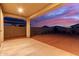 Spacious backyard featuring a covered patio, gravel landscaping, and privacy fence, perfect for outdoor enjoyment at 19873 W San Juan Ave, Litchfield Park, AZ 85340
